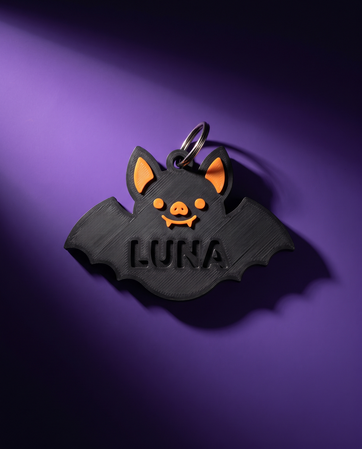 Placa de collar para perro con forma de murciélago y nombre grabado