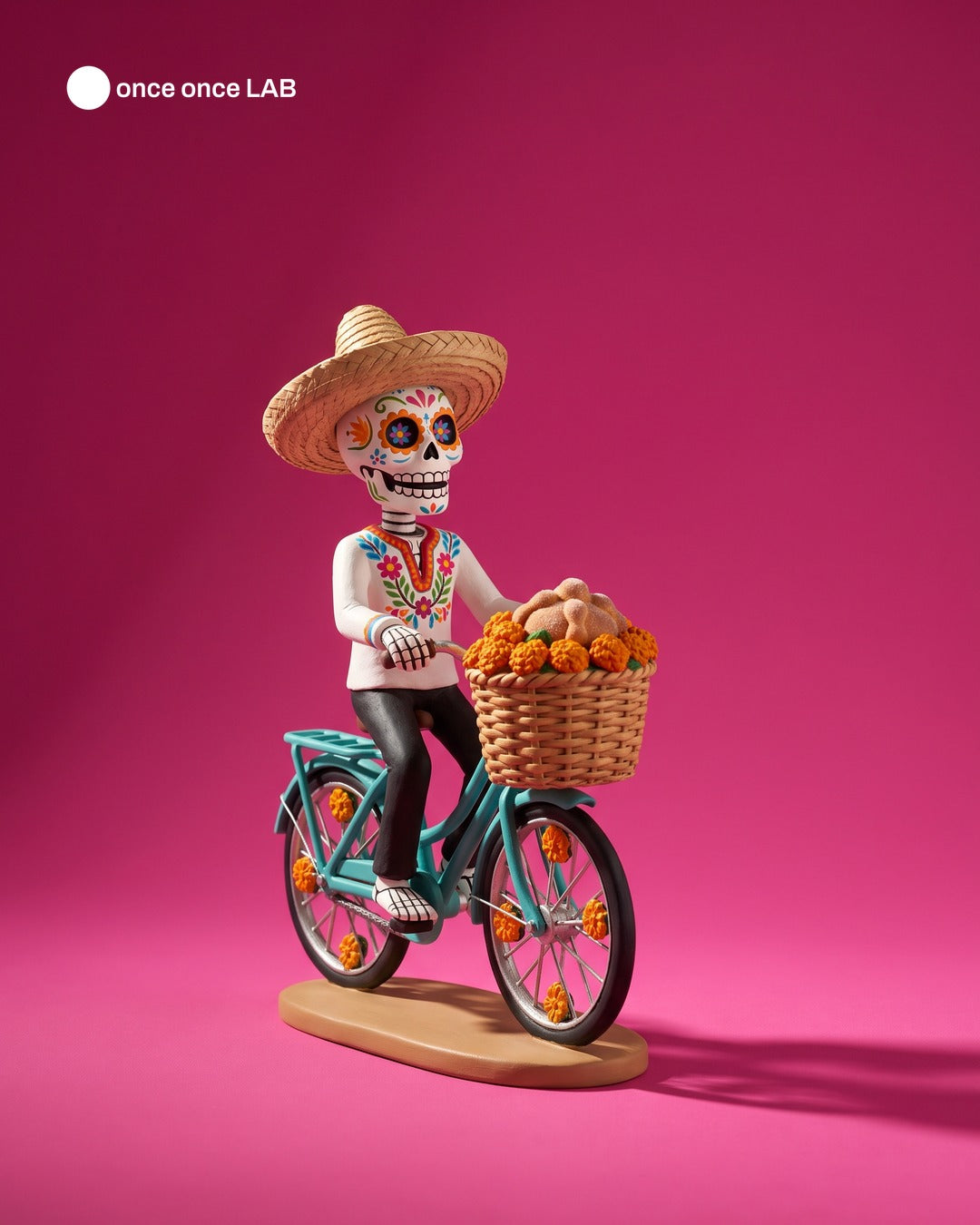 Calaverita Ciclista con Canasta de Cempasúchil — Figura para Ofrenda de Día de Muertos — Once Once Lab