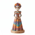 Catrina de Día de Muertos de 13 cm sobre ofrenda con cempasúchil